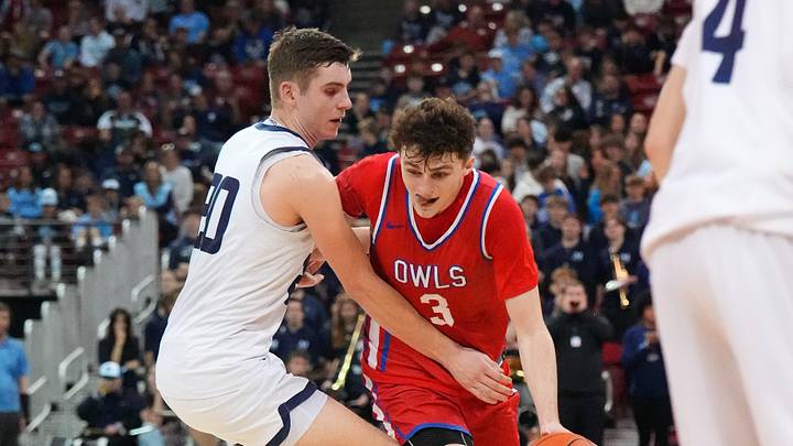 Slinger's Jack Kohnen (3) breaks for the paint against McFarland's Eli Krueger (20) during their WIAA Division 2 state semifinal basketball game on Friday, March 20, 2026, at the Kohl Center in Madison, Wisconsin. Slinger won the game, 83-56.