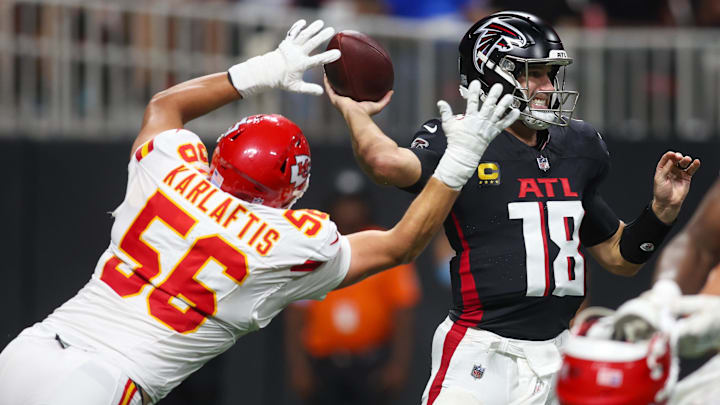 Sep 22, 2024; Atlanta, Georgia, USA; Kansas City Chiefs defensive end George Karlaftis (56) rushes Atlanta Falcons quarterback Kirk Cousins (18) in the fourth quarter at Mercedes-Benz Stadium. Mandatory Credit: Brett Davis-Imagn Images Sep 22, 2024; Atlanta, Georgia, USA; Kansas City Chiefs defensive end George Karlaftis (56) rushes Atlanta Falcons quarterback Kirk Cousins (18) in the fourth quarter at Mercedes-Benz Stadium. Mandatory Credit: Brett Davis-Imagn Images