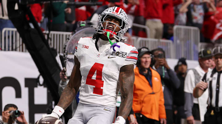 Jan 20, 2025; Atlanta, GA, USA; Ohio State Buckeyes wide receiver Jeremiah Smith (4) reacts after scoring against the Notre Dame Fighting Irish a touchdown during the first half the CFP National Championship college football game at Mercedes-Benz Stadium. Jan 20, 2025; Atlanta, GA, USA; Ohio State Buckeyes wide receiver Jeremiah Smith (4) reacts after scoring against the Notre Dame Fighting Irish a touchdown during the first half the CFP National Championship college football game at Mercedes-Benz Stadium.