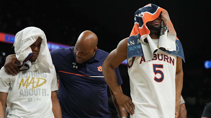 Apr 5, 2025; San Antonio, TX, USA; Auburn Tigers forward Chris Moore (5) reacts as he comes off the court after losing to the Florida Gators in the semifinals of the men's Final Four of the 2025 NCAA Tournament at the Alamodome. Mandatory Credit: Robert Deutsch-Imagn Images Apr 5, 2025; San Antonio, TX, USA; Auburn Tigers forward Chris Moore (5) reacts as he comes off the court after losing to the Florida Gators in the semifinals of the men's Final Four of the 2025 NCAA Tournament at the Alamodome. Mandatory Credit: Robert Deutsch-Imagn Images