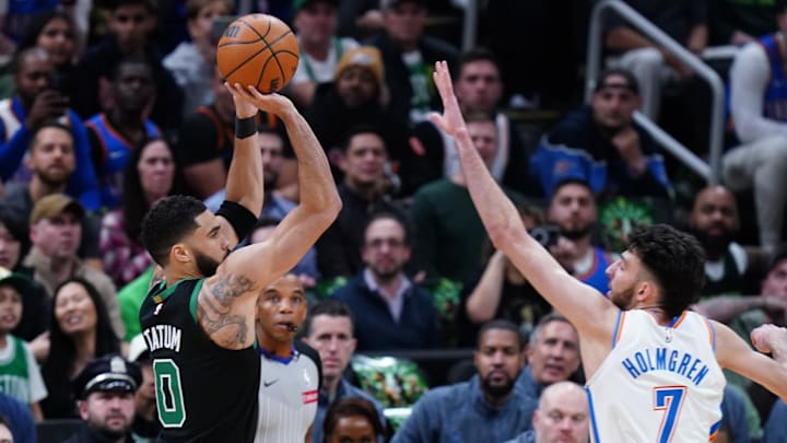 Boston Celtics forward Jayson Tatum shoots against Oklahoma City Thunder forward Chet Holmgren.