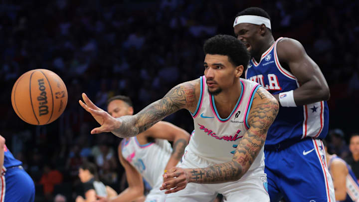 Miami Heat center Kel'el Ware (7) passes the ball after grabbing a rebound against the Philadelphia 76ers during the fourth quarter at Kaseya Center.