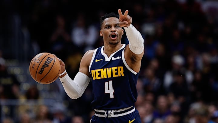 Apr 2, 2025; Denver, Colorado, USA; Denver Nuggets guard Russell Westbrook (4) gestures as he dribbles the ball up court in the third quarter against the San Antonio Spurs at Ball Arena. Mandatory Credit: Isaiah J. Downing-Imagn Images