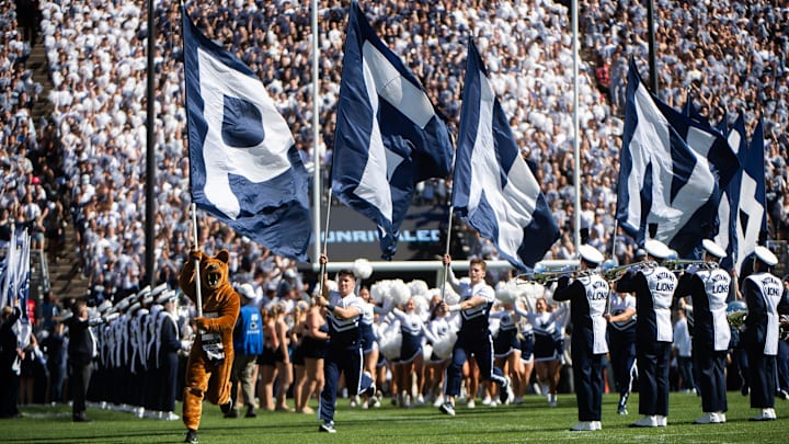 The Penn State Nittany Lion mascot leads the football team onto the field for the home opener vs. Nevada. 