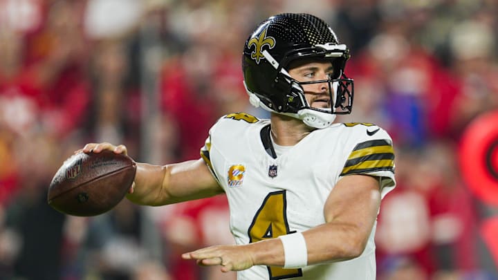 Oct 7, 2024; Kansas City, Missouri, USA; New Orleans Saints quarterback Derek Carr (4) throws a pass during the first half against the Kansas City Chiefs at GEHA Field at Arrowhead Stadium. Mandatory Credit: Jay Biggerstaff-Imagn Images