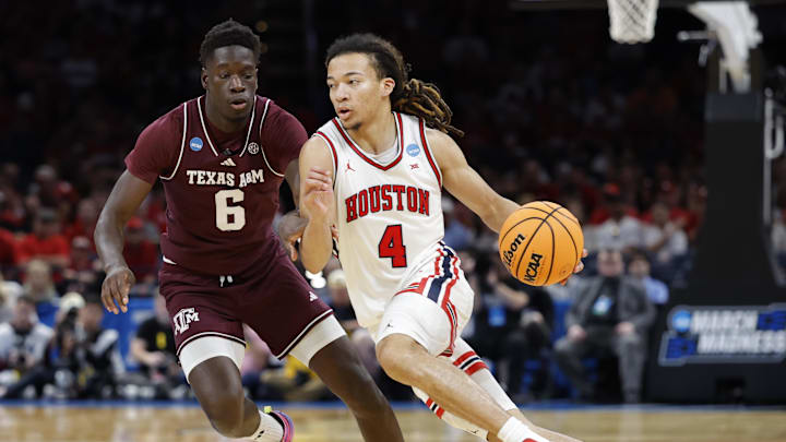 Houston Cougars guard Kingston Flemings (4) drives to the hoop past Texas A&M Aggies guard Ali Dibba (6) during the second half of a second round game of the men's 2026 NCAA Tournament at Paycom Center. 