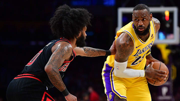 Jan 25, 2024; Los Angeles, California, USA: Los Angeles Lakers forward LeBron James (23) controls the ball against Chicago Bulls guard Coby White (0) during the first half at Crypto.com Arena. Mandatory Credit: Gary A. Vasquez-Imagn Images