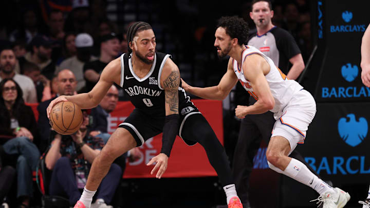 Apr 13, 2025; Brooklyn, New York, USA; Brooklyn Nets forward Trendon Watford (9) is guarded by New York Knicks guard Landry Shamet (44) during the first half at Barclays Center. Mandatory Credit: Vincent Carchietta-Imagn Images