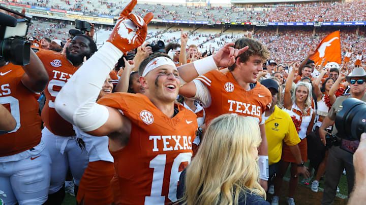 Texas Longhorns defensive back Michael Taaffe celebrates with Texas Longhorns quarterback Arch Manning after the game against the Oklahoma Sooners at the Cotton Bowl.