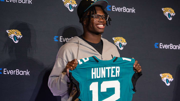 Apr 25, 2025; Jacksonville, FL, USA; Jacksonville Jaguars first round draft pick Travis Hunter poses for a photo during a press conference at Miller Electric Center. Mandatory Credit: Travis Register-Imagn Images Apr 25, 2025; Jacksonville, FL, USA; Jacksonville Jaguars first round draft pick Travis Hunter poses for a photo during a press conference at Miller Electric Center. Mandatory Credit: Travis Register-Imagn Images