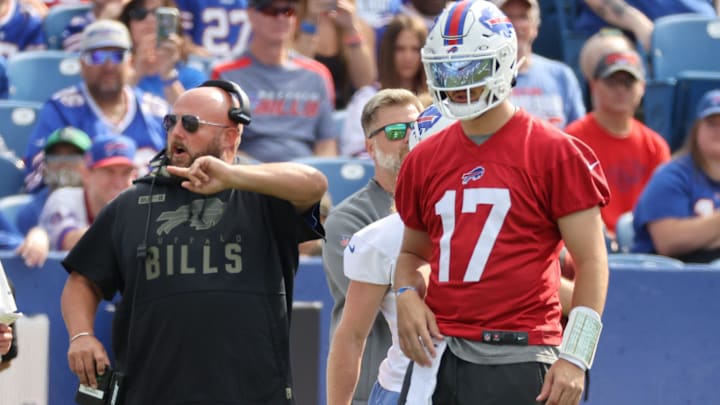 Josh Allen with offensive coordinator Brian Daboll during a training camp practice.