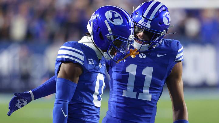 Oct 18, 2025; Provo, Utah, USA; BYU Cougars defensive back Evan Johnson (0) and safety Faletau Satuala (11) react to a defensive stand on fourth down against the Utah Utes at LaVell Edwards Stadium. Mandatory Credit: Rob Gray-Imagn Images Oct 18, 2025; Provo, Utah, USA; BYU Cougars defensive back Evan Johnson (0) and safety Faletau Satuala (11) react to a defensive stand on fourth down against the Utah Utes at LaVell Edwards Stadium. Mandatory Credit: Rob Gray-Imagn Images