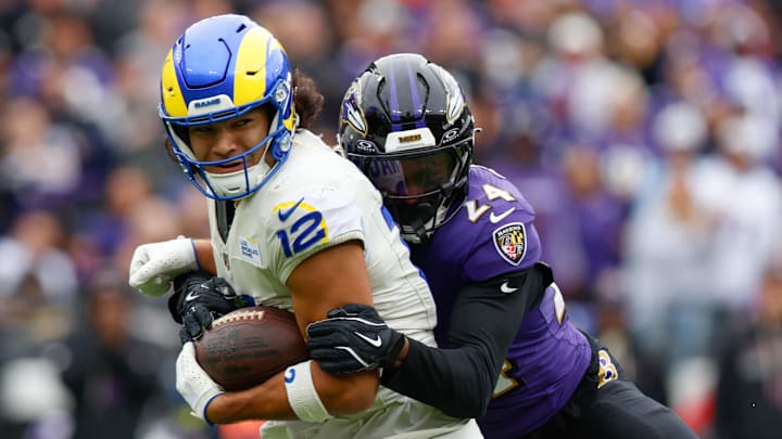 Oct 12, 2025; Baltimore, Maryland, USA; Baltimore Ravens safety Malaki Starks (24) tackles Los Angeles Rams wide receiver Puka Nacua (12) during the second quarter of the game at M&T Bank Stadium. Mandatory Credit: Peter Casey-Imagn Images Oct 12, 2025; Baltimore, Maryland, USA; Baltimore Ravens safety Malaki Starks (24) tackles Los Angeles Rams wide receiver Puka Nacua (12) during the second quarter of the game at M&T Bank Stadium. Mandatory Credit: Peter Casey-Imagn Images