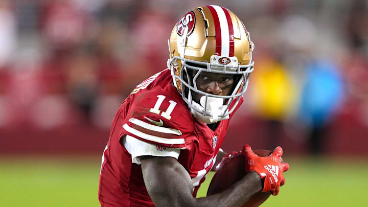 Sep 9, 2024; Santa Clara, California, USA; San Francisco 49ers wide receiver Brandon Aiyuk (11) runs after a catch against the New York Jets during the fourth quarter at Levi's Stadium. Mandatory Credit: Darren Yamashita-Imagn Images