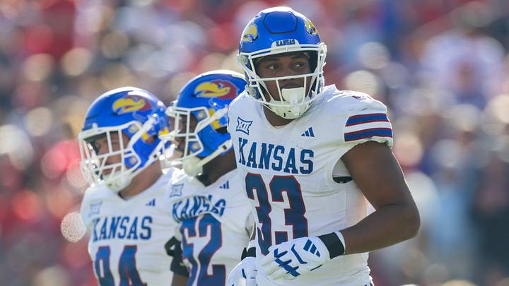 Nov 8, 2025; Tucson, Arizona, USA; Kansas Jayhawks defensive end Leroy Harris III (33) against the Arizona Wildcats at Arizona Stadium. Mandatory Credit: Mark J. Rebilas-Imagn Images Nov 8, 2025; Tucson, Arizona, USA; Kansas Jayhawks defensive end Leroy Harris III (33) against the Arizona Wildcats at Arizona Stadium. Mandatory Credit: Mark J. Rebilas-Imagn Images
