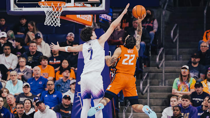 Christian King tries to block a shot by Illinois's Tre White. Christian King tries to block a shot by Illinois's Tre White.