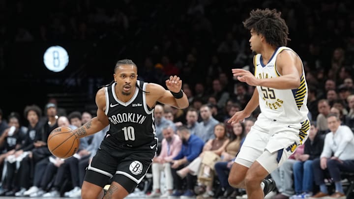 Apr 9, 2026; Brooklyn, New York, USA; Brooklyn Nets guard Tyson Etienne (10) dribbles the ball against Indiana Pacers guard Ethan Thompson (55) during the first half at Barclays Center. Mandatory Credit: Gregory Fisher-Imagn Images