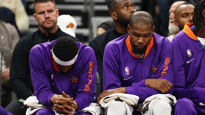 Dec 19, 2024; Phoenix, Arizona, USA; Phoenix Suns guard Bradley Beal (left) and forward Kevin Durant react on the bench against the Indiana Pacers at Footprint Center. Mandatory Credit: Mark J. Rebilas-Imagn Images