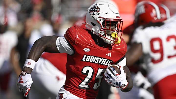 Sep 7, 2024; Louisville, Kentucky, USA; Louisville Cardinals running back Isaac Brown (25) runs the ball against the Jacksonville State Gamecocks during the second half at L&N Federal Credit Union Stadium. Louisville defeated Jacksonville State 49-14. Mandatory Credit: Jamie Rhodes-Imagn Images Sep 7, 2024; Louisville, Kentucky, USA; Louisville Cardinals running back Isaac Brown (25) runs the ball against the Jacksonville State Gamecocks during the second half at L&N Federal Credit Union Stadium. Louisville defeated Jacksonville State 49-14. Mandatory Credit: Jamie Rhodes-Imagn Images
