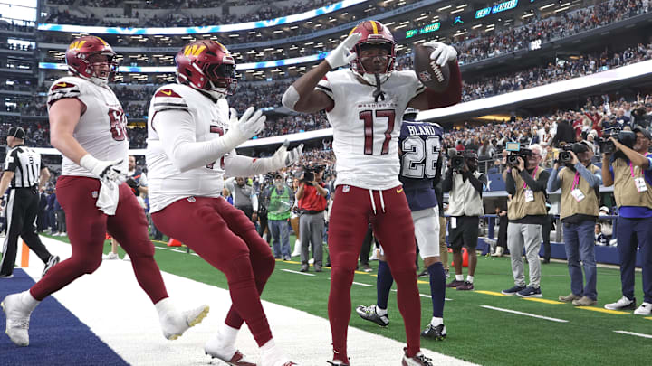 Jan 5, 2025; Arlington, Texas, USA; Washington Commanders wide receiver Terry McLaurin (17) and his teammates celebrate the game winning touchdown against the Dallas Cowboys during the fourth quarter at AT&T Stadium. Mandatory Credit: Tim Heitman-Imagn Images Jan 5, 2025; Arlington, Texas, USA; Washington Commanders wide receiver Terry McLaurin (17) and his teammates celebrate the game winning touchdown against the Dallas Cowboys during the fourth quarter at AT&T Stadium. Mandatory Credit: Tim Heitman-Imagn Images