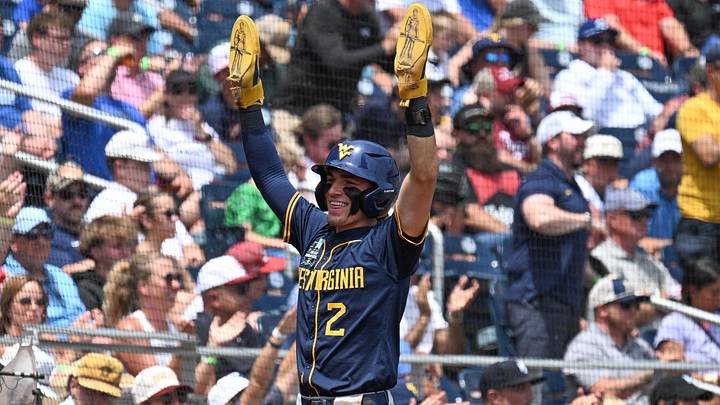 Jun 16, 2026; Omaha, NE, USA; West Virginia Mountaineers second baseman Gavin Kelly (2) reacts after scoring against the Troy Trojans during the second inning at Charles Schwab Field. Mandatory Credit: Steven Branscombe-Imagn Images Jun 16, 2026; Omaha, NE, USA; West Virginia Mountaineers second baseman Gavin Kelly (2) reacts after scoring against the Troy Trojans during the second inning at Charles Schwab Field. Mandatory Credit: Steven Branscombe-Imagn Images