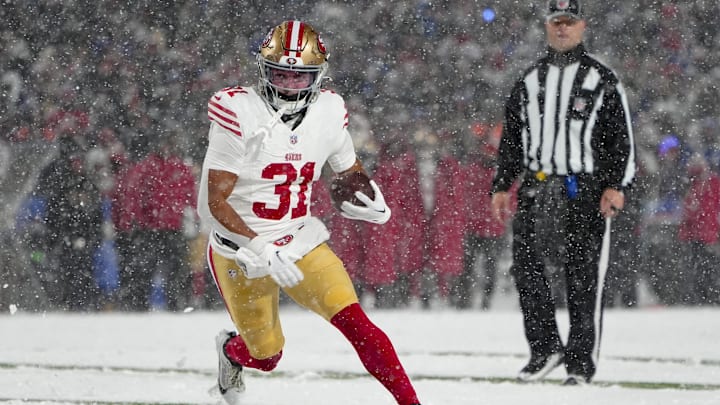 Dec 1, 2024; Orchard Park, New York, USA; San Francisco 49ers running back Isaac Guerendo (31) runs with the ball for a touchdown against the Buffalo Bills during the second half at Highmark Stadium. Mandatory Credit: Gregory Fisher-Imagn Images Dec 1, 2024; Orchard Park, New York, USA; San Francisco 49ers running back Isaac Guerendo (31) runs with the ball for a touchdown against the Buffalo Bills during the second half at Highmark Stadium. Mandatory Credit: Gregory Fisher-Imagn Images