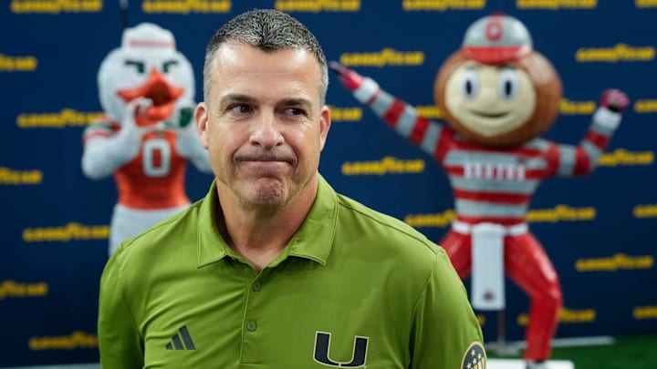 Miami Hurricanes head coach Mario Cristobal speaks during the Cotton Bowl Media Day at AT&T Stadium in Dallas prior to the College Football Playoff matchup against the Ohio State Buckeyes on Dec. 29, 2025. Miami Hurricanes head coach Mario Cristobal speaks during the Cotton Bowl Media Day at AT&T Stadium in Dallas prior to the College Football Playoff matchup against the Ohio State Buckeyes on Dec. 29, 2025.