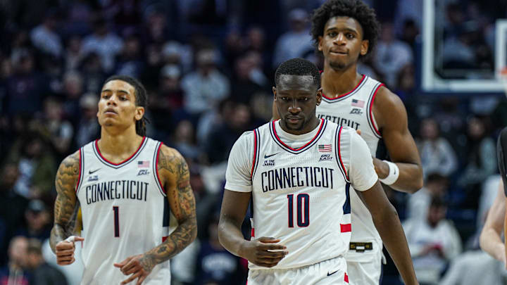 Feb 7, 2025; Storrs, Connecticut, USA; UConn Huskies guard Hassan Diarra (10), center Tarris Reed Jr. (5) and guard Solo Ball (1) on the court after a defeat by the St. John's Red Storm at Harry A. Gampel Pavilion. Mandatory Credit: David Butler II-Imagn Images
