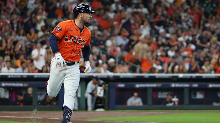 Oct 2, 2024; Houston, Texas, USA; Houston Astros third base Alex Bregman (2) runs after hitting a single against the Detroit Tigers during the second inning of game two of the Wildcard round for the 2024 MLB Playoffs at Minute Maid Park. 