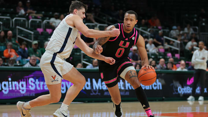 Jan 29, 2025; Coral Gables, Florida, USA; Miami Hurricanes guard Matthew Cleveland (0) drives to the basket against past Virginia Cavaliers guard Taine Murray (10) during the second half at Watsco Center. Mandatory Credit: Sam Navarro-Imagn Images Jan 29, 2025; Coral Gables, Florida, USA; Miami Hurricanes guard Matthew Cleveland (0) drives to the basket against past Virginia Cavaliers guard Taine Murray (10) during the second half at Watsco Center. Mandatory Credit: Sam Navarro-Imagn Images
