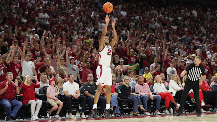 Oct 25, 2024; Fayetteville, AR, USA; Arkansas Razorbacks guard D.J. Wagner (21) shoots a three-point shot in the second half against the Kansas Jayhawks at Bud Walton Arena. Mandatory Credit: Nelson Chenault-Imagn Images