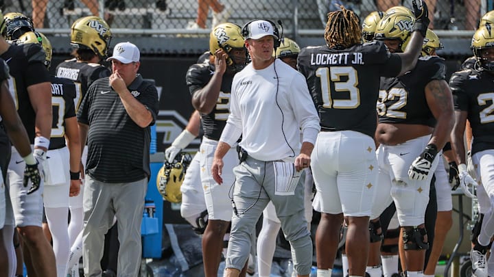Sep 20, 2025; Orlando, Florida, USA; UCF Knights head coach Scott Frost looks on during the first quarter against the North Carolina Tar Heels at the Bounce House Stadium. Mandatory Credit: Mike Watters-Imagn Images