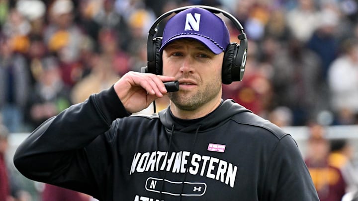 Nov 22, 2025; Chicago, Illinois, USA; Northwestern Wildcats head coach David Braun is seen against the Minnesota Golden Gophers during the first half at Wrigley Field. Nov 22, 2025; Chicago, Illinois, USA; Northwestern Wildcats head coach David Braun is seen against the Minnesota Golden Gophers during the first half at Wrigley Field.
