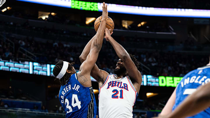 Jan 19, 2024; Orlando, Florida, USA; Philadelphia 76ers center Joel Embiid (21) shoots the ball over