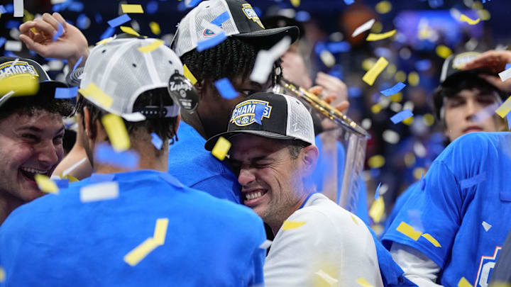 Florida head coach Todd Golden and the team celebrate their win over Tennessee after the Southeastern Conference tournament championship at Bridgestone Arena in Nashville, Tenn., Sunday, March 16, 2025.