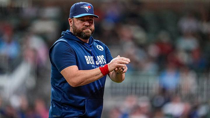 Blue Jays manager John Schneider (14) on the field against the Atlanta Braves during the eighth inning at Truist Park. Blue Jays manager John Schneider (14) on the field against the Atlanta Braves during the eighth inning at Truist Park.