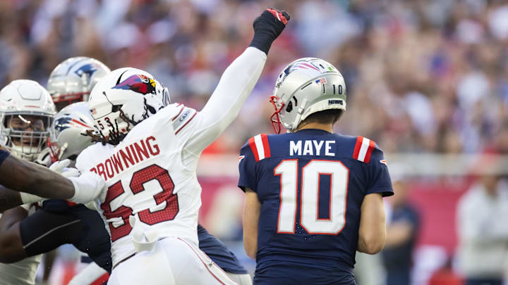 Dec 15, 2024; Glendale, Arizona, USA; New England Patriots quarterback Drake Maye (10) against Arizona Cardinals linebacker Baron Browning (53) at State Farm Stadium. Mandatory Credit: Mark J. Rebilas-Imagn Images Dec 15, 2024; Glendale, Arizona, USA; New England Patriots quarterback Drake Maye (10) against Arizona Cardinals linebacker Baron Browning (53) at State Farm Stadium. Mandatory Credit: Mark J. Rebilas-Imagn Images