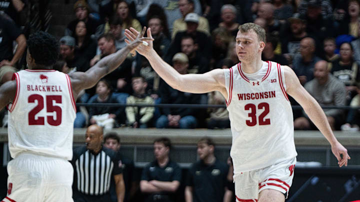 Mar 7, 2026; West Lafayette, Indiana, USA; Wisconsin Badgers forward Aleksas Bieliauskas (32) high fives Wisconsin Badgers guard John Blackwell (25) during the second half at Mackey Arena. Mandatory Credit: Jacob Musselman-Imagn Images Mar 7, 2026; West Lafayette, Indiana, USA; Wisconsin Badgers forward Aleksas Bieliauskas (32) high fives Wisconsin Badgers guard John Blackwell (25) during the second half at Mackey Arena. Mandatory Credit: Jacob Musselman-Imagn Images