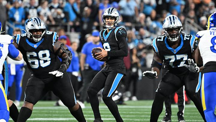 Carolina Panthers quarterback Bryce Young (9) looks to pass as guard Damien Lewis (68) and offensive tackle Yosh Nijman (77) block Carolina Panthers quarterback Bryce Young (9) looks to pass as guard Damien Lewis (68) and offensive tackle Yosh Nijman (77) block