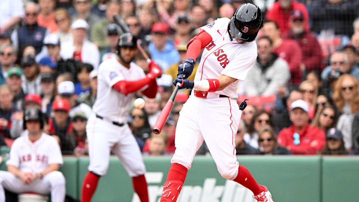 May 25, 2025; Boston, Massachusetts, USA; Boston Red Sox shortstop Marcelo Mayer (39) hits a single against the Baltimore Orioles for his first MLB hit during the second inning at Fenway Park. Mandatory Credit: Brian Fluharty-Imagn Images