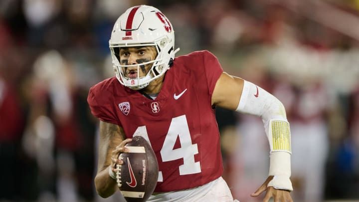 Nov 18, 2023; Stanford, California, USA; Stanford Cardinal quarterback Ashton Daniels (14) runs with the ball against the California Golden Bears during the third quarter at Stanford Stadium. Nov 18, 2023; Stanford, California, USA; Stanford Cardinal quarterback Ashton Daniels (14) runs with the ball against the California Golden Bears during the third quarter at Stanford Stadium.