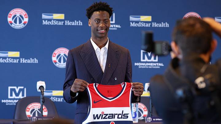 AJ Dybantsa, the Washington Wizards' top overall pick in this year's NBA Draft, poses for a photo with his jersey during a press conference at InterContinental Hotel.