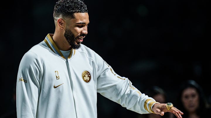 Oct 22, 2024; Boston, Massachusetts, USA; Boston Celtics forward Jayson Tatum (0) reacts after receiving his championship ring during the opening night banner raising ceremony before the start of the game against the New York Knicks at TD Garden. Mandatory Credit: David Butler II-Imagn Images