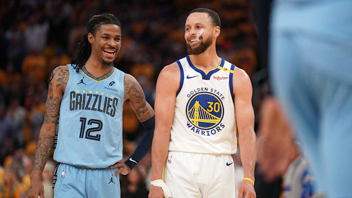 Apr 15, 2025; San Francisco, California, USA; Memphis Grizzlies guard Ja Morant (12) talks with Golden State Warriors guard Stephen Curry (30) in between free throw by Curry in the fourth quarter at the Chase Center. Mandatory Credit: Cary Edmondson-Imagn Images