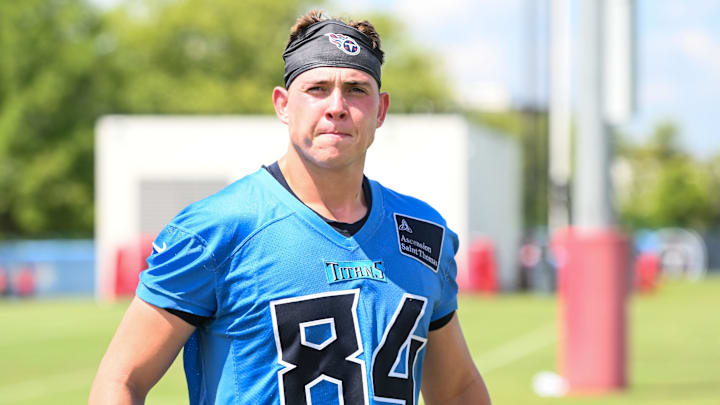 Jul 23, 2025; Nashville, TN, USA;  Tennessee Titans tight end Gunnar Helm (84) walks off the field during training camp at Ascension Saint Thomas Sports Park. Mandatory Credit: Steve Roberts-Imagn Images