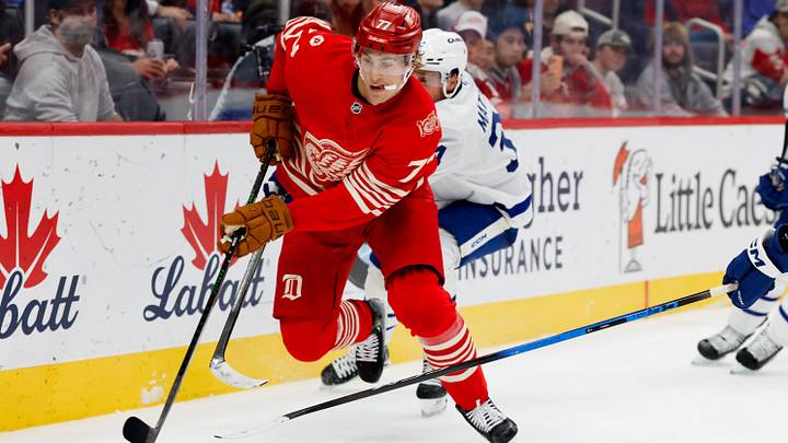 Oct 11, 2025; Detroit, Michigan, USA; Detroit Red Wings defenseman Simon Edvinsson (77) skates with the puck chased by Toronto Maple Leafs center Auston Matthews (34) in the third period at Little Caesars Arena. Mandatory Credit: Rick Osentoski-Imagn Images Oct 11, 2025; Detroit, Michigan, USA; Detroit Red Wings defenseman Simon Edvinsson (77) skates with the puck chased by Toronto Maple Leafs center Auston Matthews (34) in the third period at Little Caesars Arena. Mandatory Credit: Rick Osentoski-Imagn Images