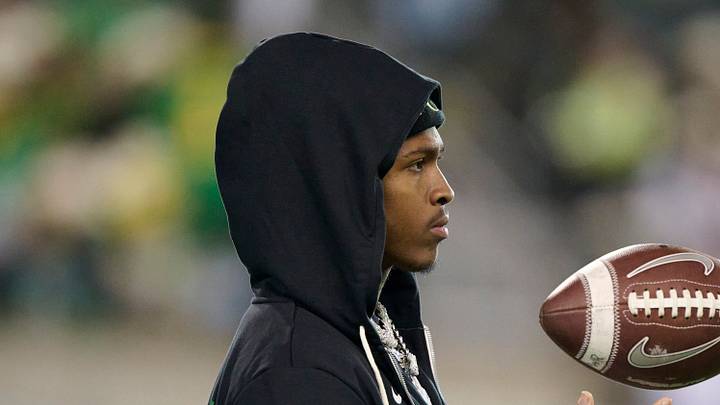 Nov 14, 2025; Eugene, Oregon, USA; Oregon Ducks wide receiver Dakorien Moore (1) watches teammates warm up before a game against the Minnesota Golden Gophers at Autzen Stadium. Nov 14, 2025; Eugene, Oregon, USA; Oregon Ducks wide receiver Dakorien Moore (1) watches teammates warm up before a game against the Minnesota Golden Gophers at Autzen Stadium.
