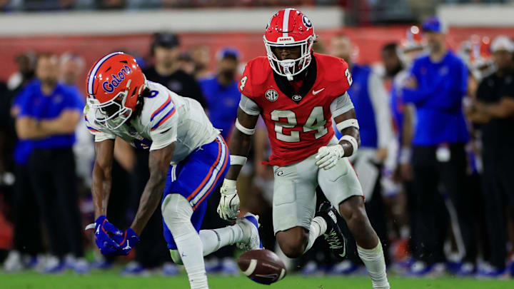 Florida Gators wide receiver Elijhah Badger (6) can’t haul in a reception against Georgia Bulldogs defensive back Malaki Starks (24) during the fourth quarter of an NCAA college football matchup Saturday, Nov. 2, 2024 at EverBank Stadium in Jacksonville, Fla. The Georgia Bulldogs defeated the Florida Gators 34-20.