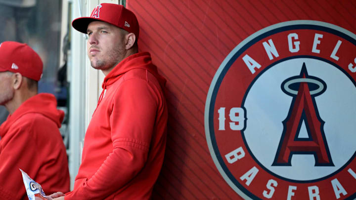 Jun 19, 2024; Anaheim, California, USA;  Los Angeles Angels center fielder Mike Trout (27) looks on from the dugout against the Milwaukee Brewers at Angel Stadium. Mandatory Credit: Jayne Kamin-Oncea-Imagn Images