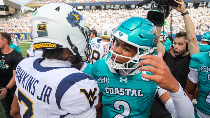 Sep 5, 2026; Morgantown, West Virginia, USA;  West Virginia Mountaineers quarterback Michael Hawkins Jr. (3) and Coastal Carolina Chanticleers quarterback Deuce Bailey (2) speak after the game at Milan Puskar Stadium.  Mandatory Credit: Ben Queen-Imagn Images